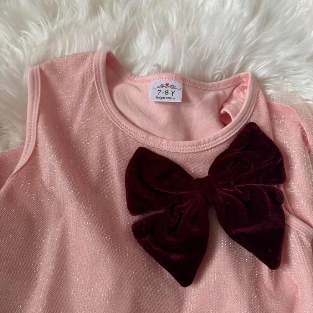 Pink shimmer dress with velvet bow